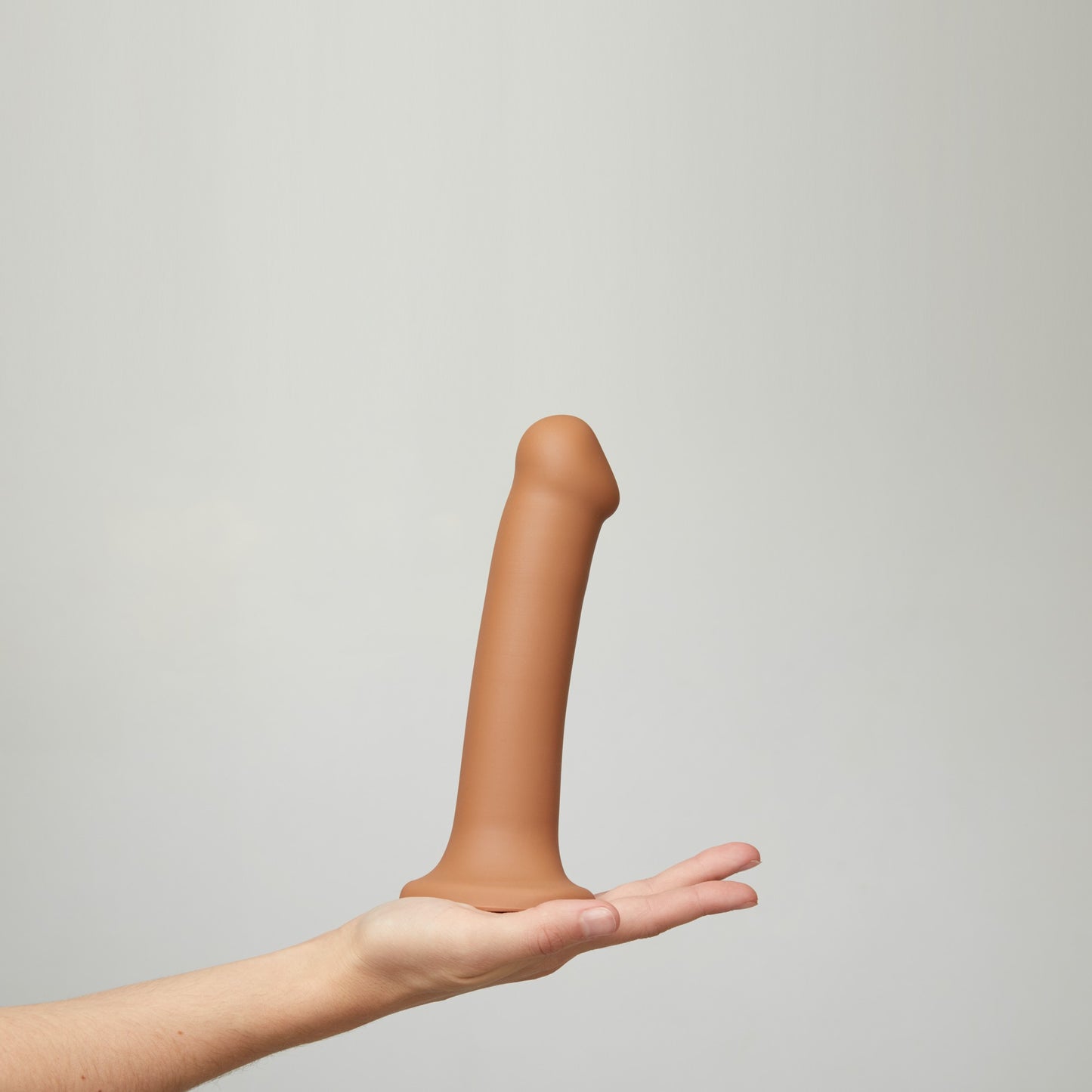Bendable dual-density strap-on dildo